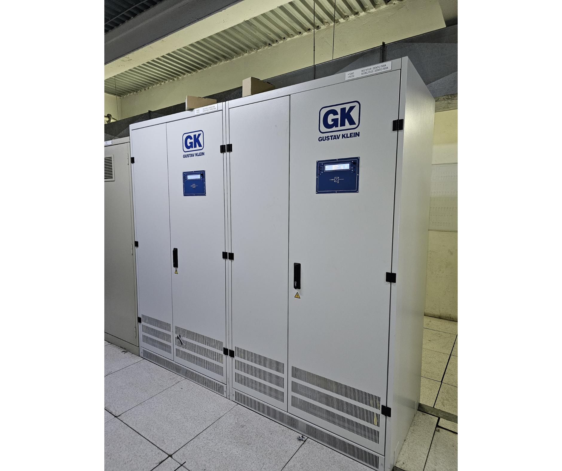 Two 220 V DC rectifier cabinets with control panels in an electrical plant room
